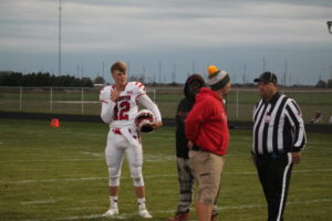 GARRETT WOODWARD GUIDED THE MILLINGTON CARDINALS FOOTBALL TEAM TO A VICTORY OVER THE EPB LAKERS ON THE ROAD…..